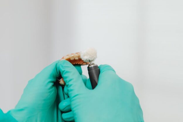 Dentist assistant is working on tooth