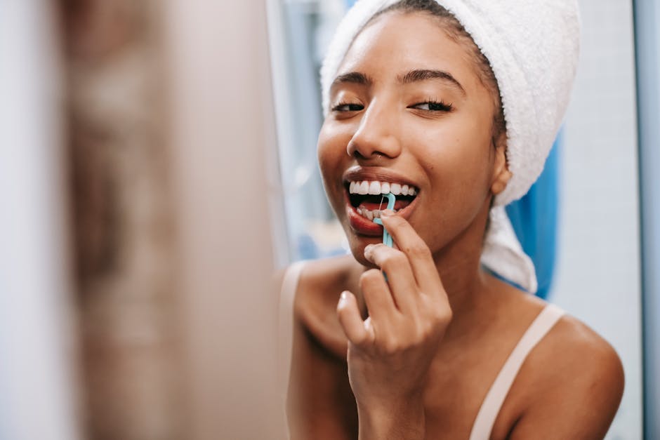 Femail is flossing her teeth